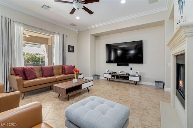 living room with visible vents, a lit fireplace, and ornamental molding