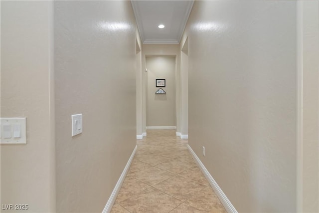 hallway featuring crown molding, light tile patterned flooring, recessed lighting, and baseboards