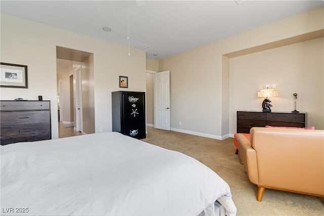 bedroom with light carpet, visible vents, attic access, and baseboards