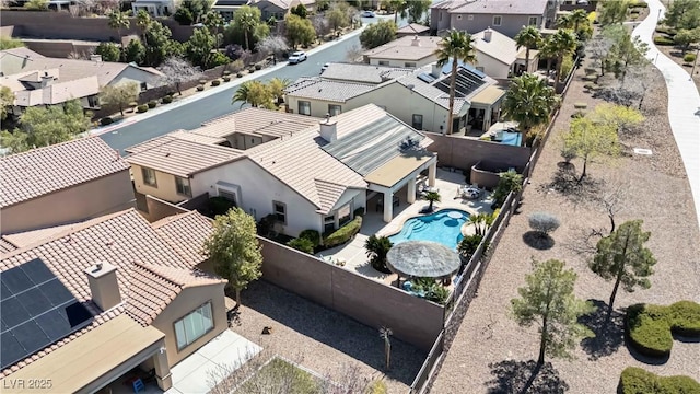 birds eye view of property with a residential view