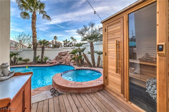 view of pool featuring a fenced in pool, an in ground hot tub, and a fenced backyard