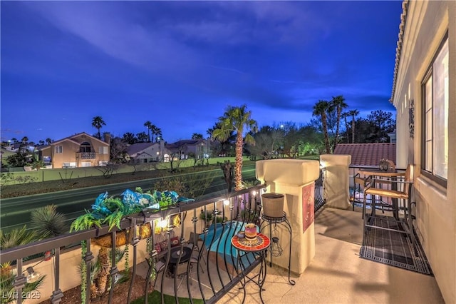 view of patio featuring a balcony