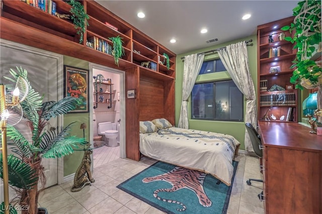 tiled bedroom featuring recessed lighting, visible vents, and ensuite bathroom