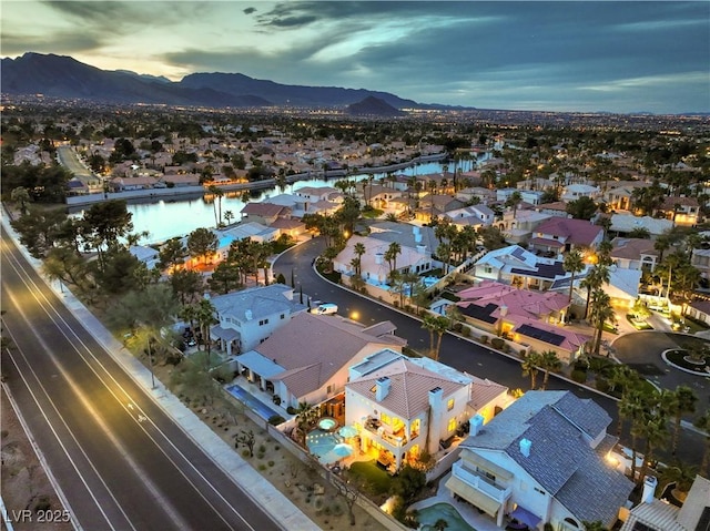 birds eye view of property featuring a residential view and a water and mountain view