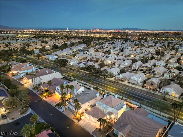 birds eye view of property with a residential view