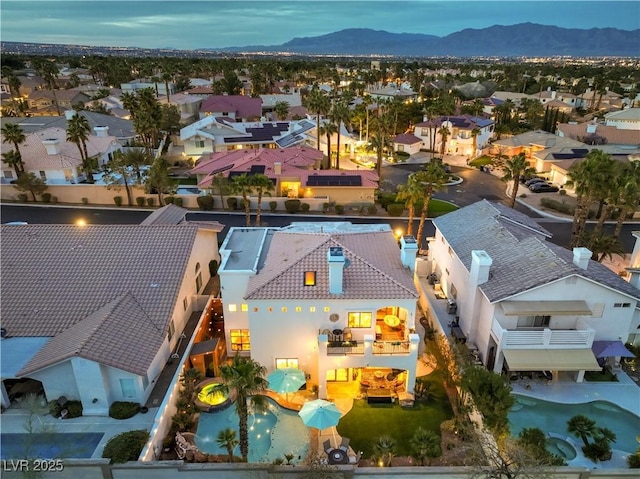 birds eye view of property featuring a mountain view and a residential view