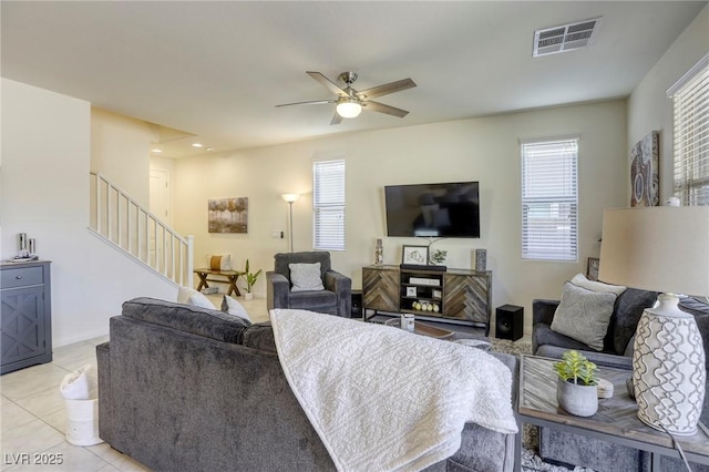 living room featuring stairway, light tile patterned floors, a ceiling fan, visible vents, and recessed lighting