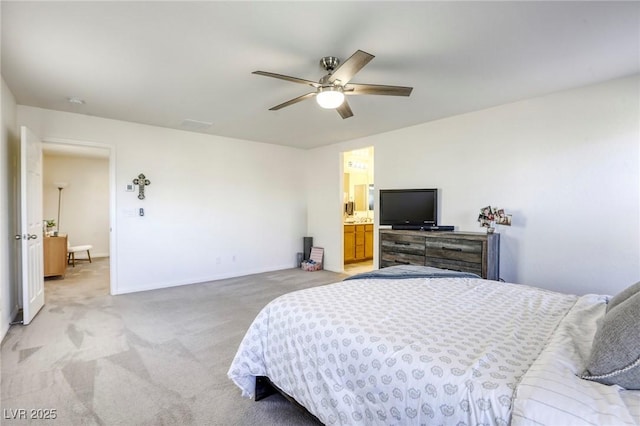 bedroom with a ceiling fan, light colored carpet, and baseboards