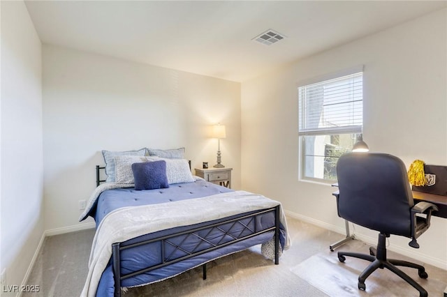 carpeted bedroom with baseboards and visible vents