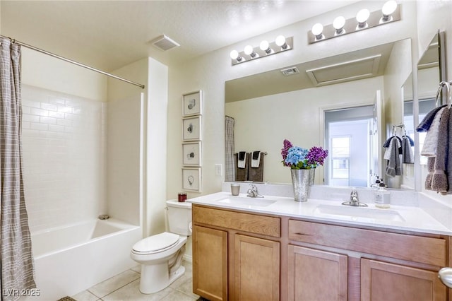 full bath featuring tile patterned floors, visible vents, toilet, and a sink