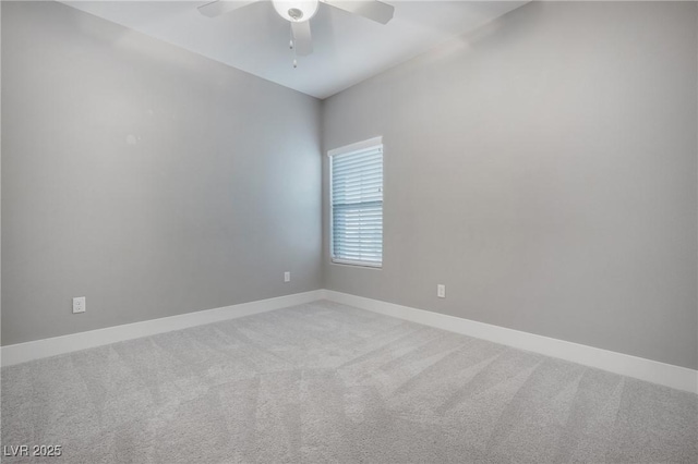 carpeted empty room with baseboards and ceiling fan