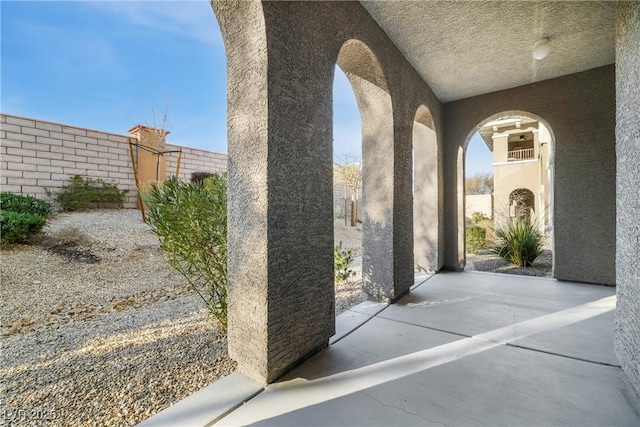 view of patio / terrace featuring fence