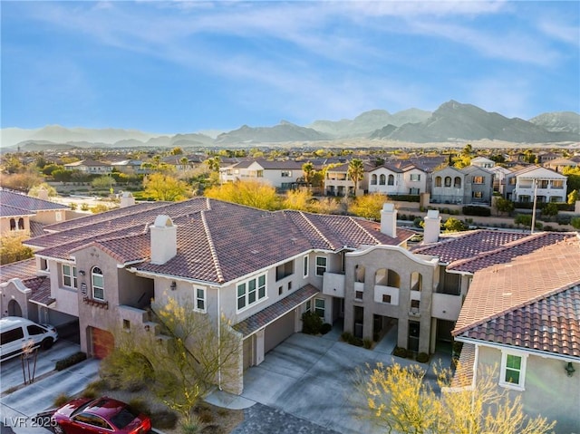 drone / aerial view with a residential view and a mountain view