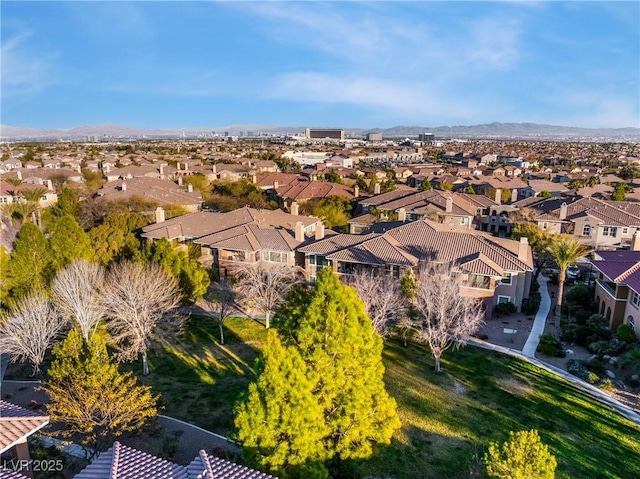 birds eye view of property with a mountain view and a residential view