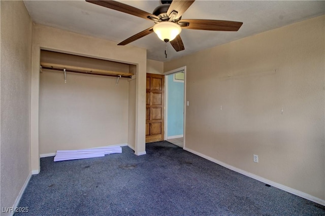 unfurnished bedroom with a closet, baseboards, and dark colored carpet