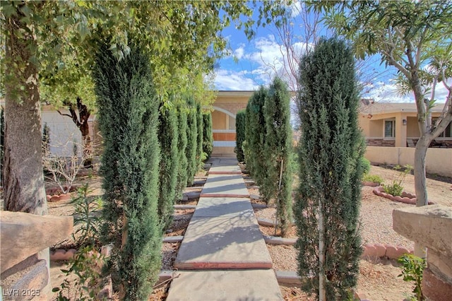 view of home's community featuring fence