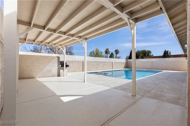 view of swimming pool featuring a fenced in pool, a fenced backyard, and a patio area