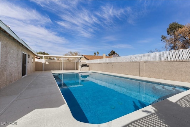 view of swimming pool with a fenced in pool, a patio, and a fenced backyard