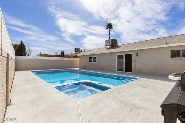 view of swimming pool featuring a fenced backyard, central AC, a pool with connected hot tub, and a patio