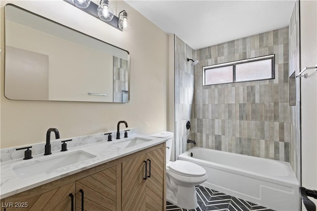 bathroom featuring shower / bathing tub combination, toilet, double vanity, and a sink