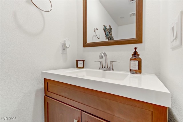 bathroom featuring visible vents and vanity