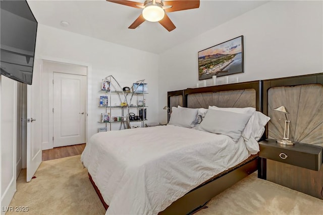 carpeted bedroom featuring a ceiling fan