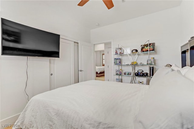 bedroom with a ceiling fan and a closet