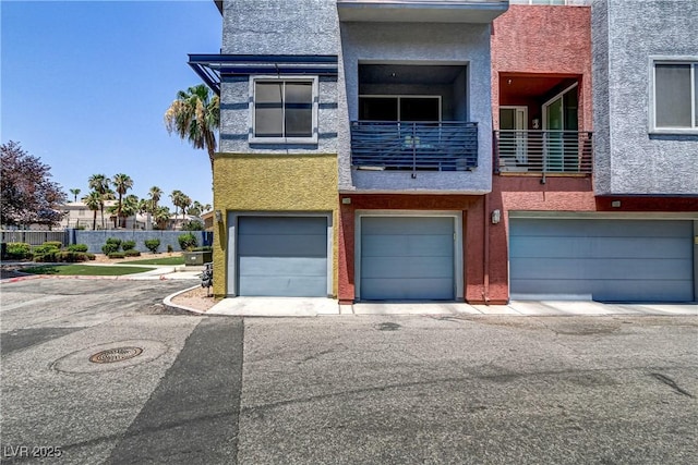 view of front of property featuring stucco siding and a garage