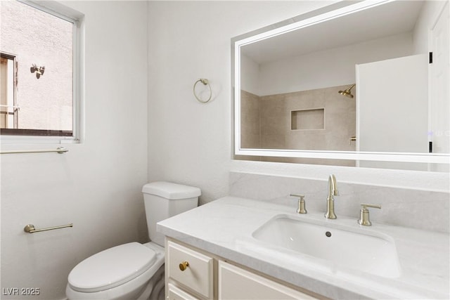 3021 Ocean Port Dr, Las Vegas, NV 89117 - bathroom featuring toilet, walk in shower, and vanity