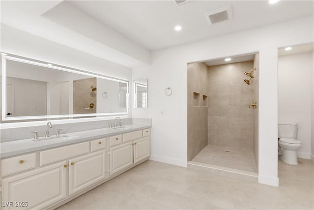 full bath with a sink, visible vents, tiled shower, and toilet