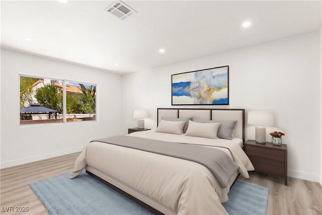 bedroom with recessed lighting, visible vents, and light wood finished floors