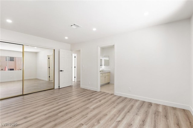 unfurnished bedroom with recessed lighting, visible vents, baseboards, and light wood finished floors