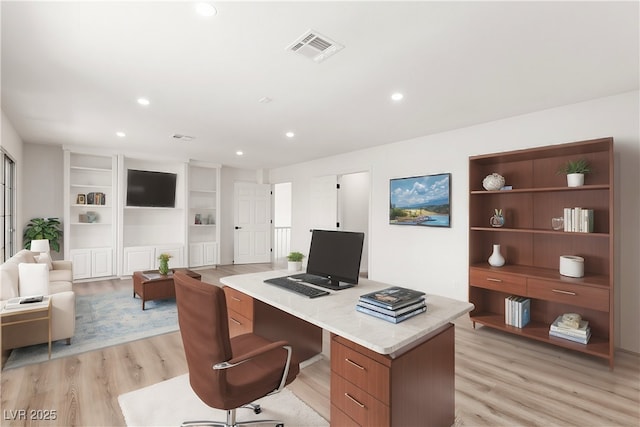 office area featuring recessed lighting, visible vents, and light wood-style flooring