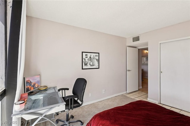 bedroom featuring visible vents and baseboards