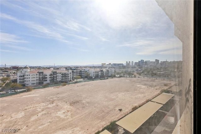 birds eye view of property featuring a city view