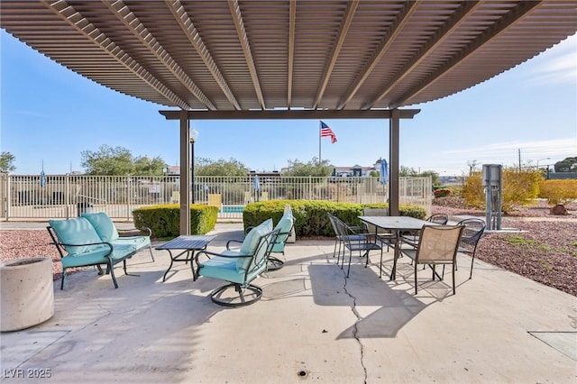 view of patio / terrace with outdoor dining area, fence, and a pergola