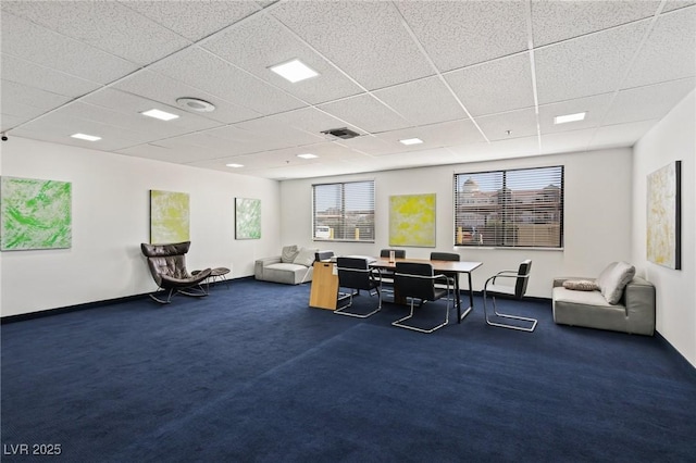 carpeted home office featuring baseboards, visible vents, and a paneled ceiling