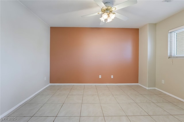 unfurnished room with baseboards and a ceiling fan