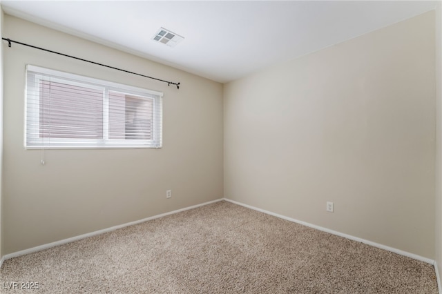 empty room with visible vents, carpet flooring, and baseboards