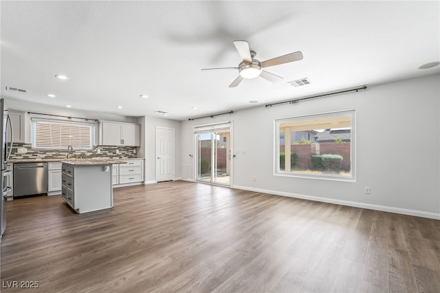 206 Lynbrook St, Henderson, NV 89012 - unfurnished living room with a ceiling fan, plenty of natural light, dark wood-style floors, and recessed lighting
