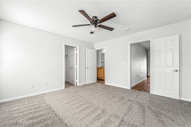 206 Lynbrook St, Henderson, NV 89012 - unfurnished bedroom featuring dark colored carpet, a spacious closet, ensuite bathroom, and a ceiling fan