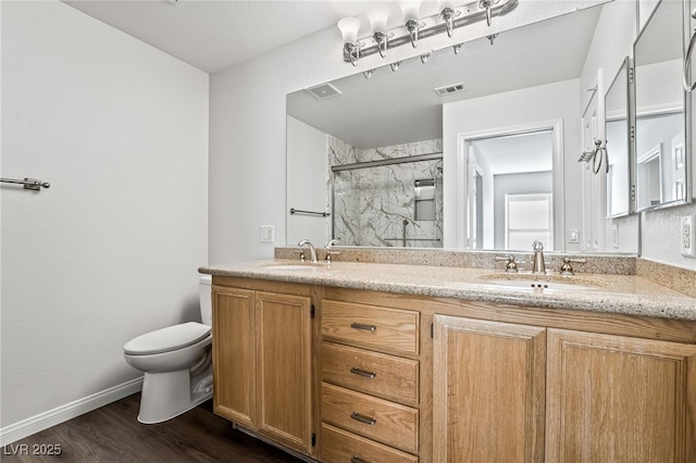 206 Lynbrook St, Henderson, NV 89012 - full bathroom featuring a marble finish shower, double vanity, and wood finished floors