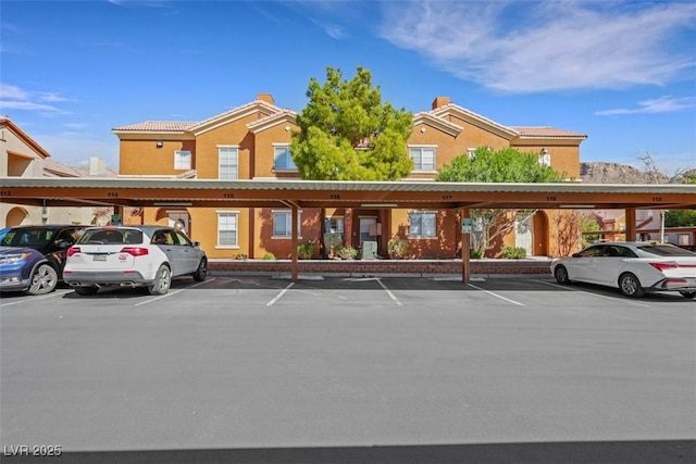 view of building exterior with covered parking