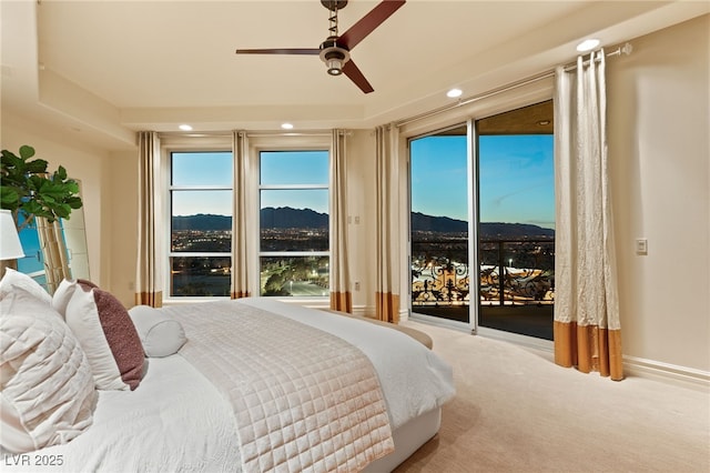 carpeted bedroom with access to outside, recessed lighting, a mountain view, baseboards, and ceiling fan