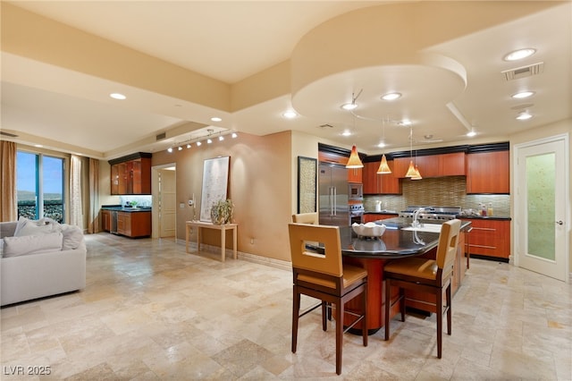 dining area with recessed lighting, baseboards, and visible vents