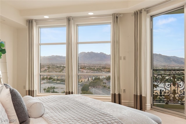 bedroom featuring a mountain view