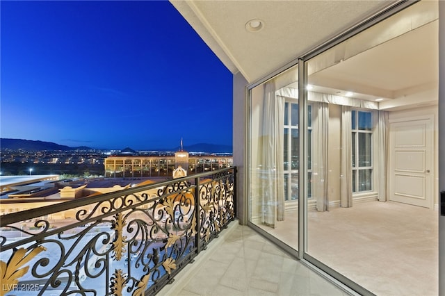 view of balcony at twilight