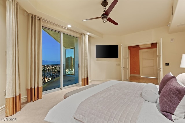 carpeted bedroom featuring baseboards, ceiling fan, and access to outside