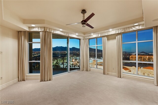 spare room featuring recessed lighting, baseboards, ceiling fan, and carpet flooring