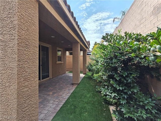 view of yard featuring a patio and fence